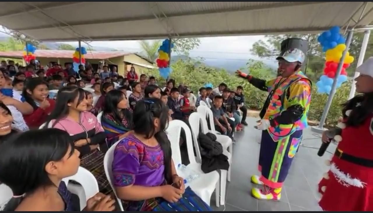 A clown performing for the crowd