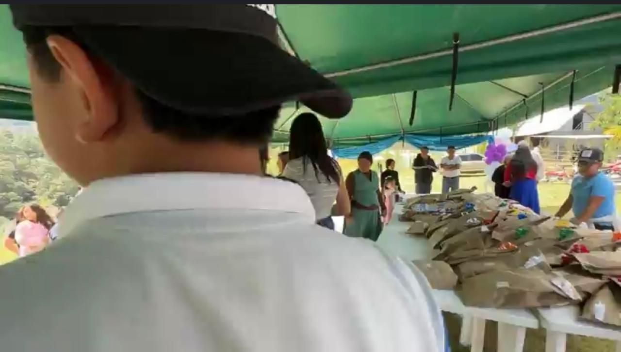 Food set out on tables under a tent