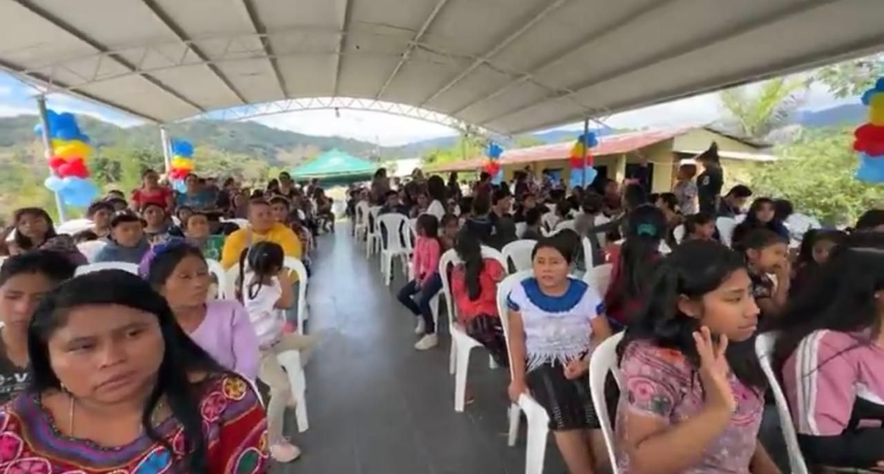 Families seated under the canopy